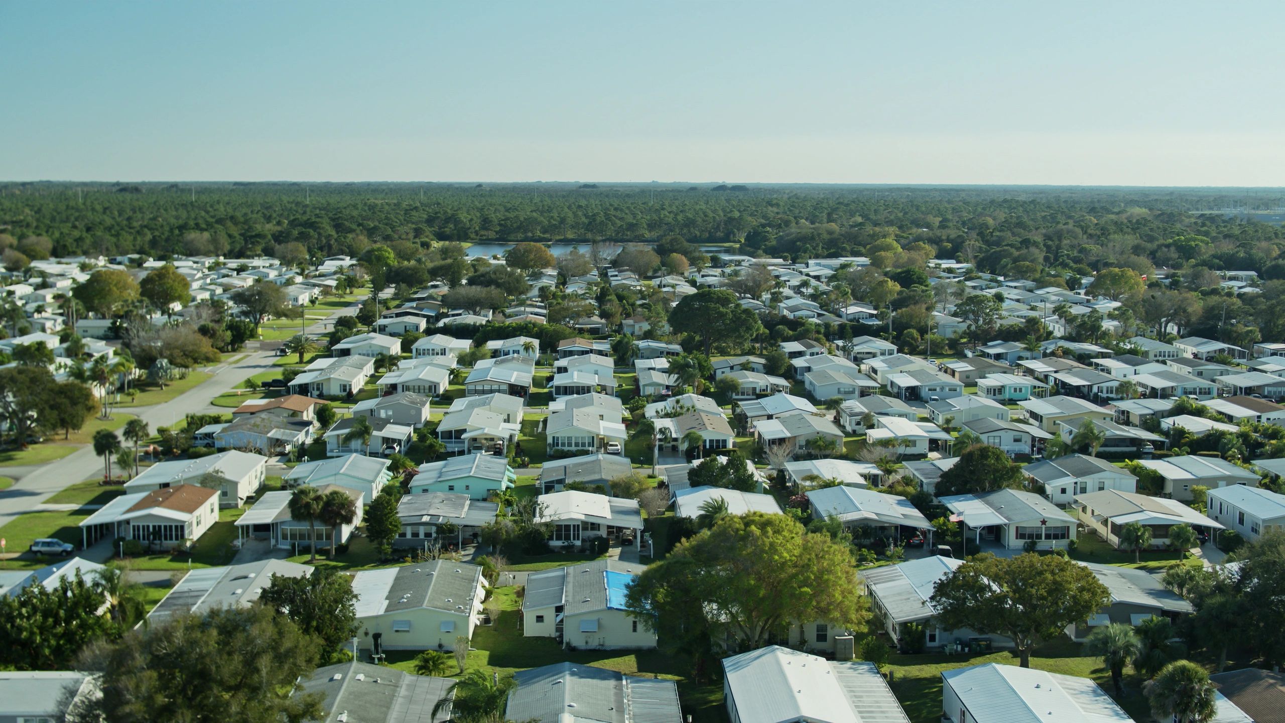 Aerial view of a residential community, representing roofing system options