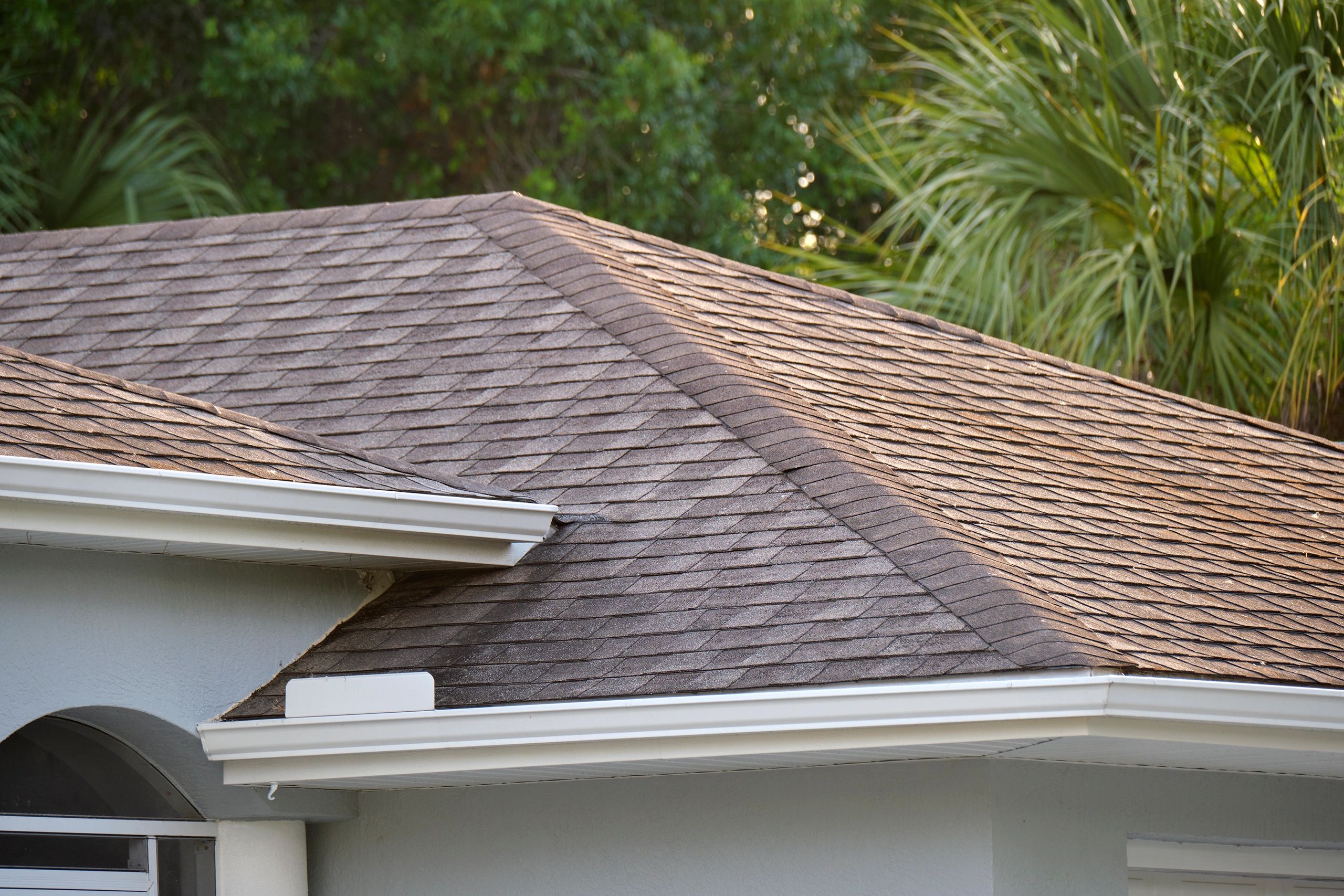 Close-up of architectural asphalt shingles on a roof
