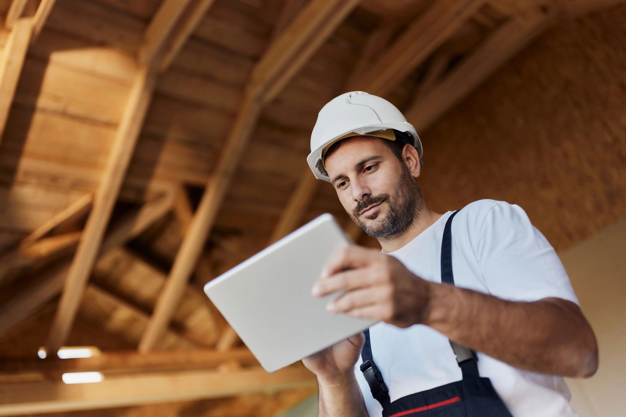 Construction professional reviewing project details on site