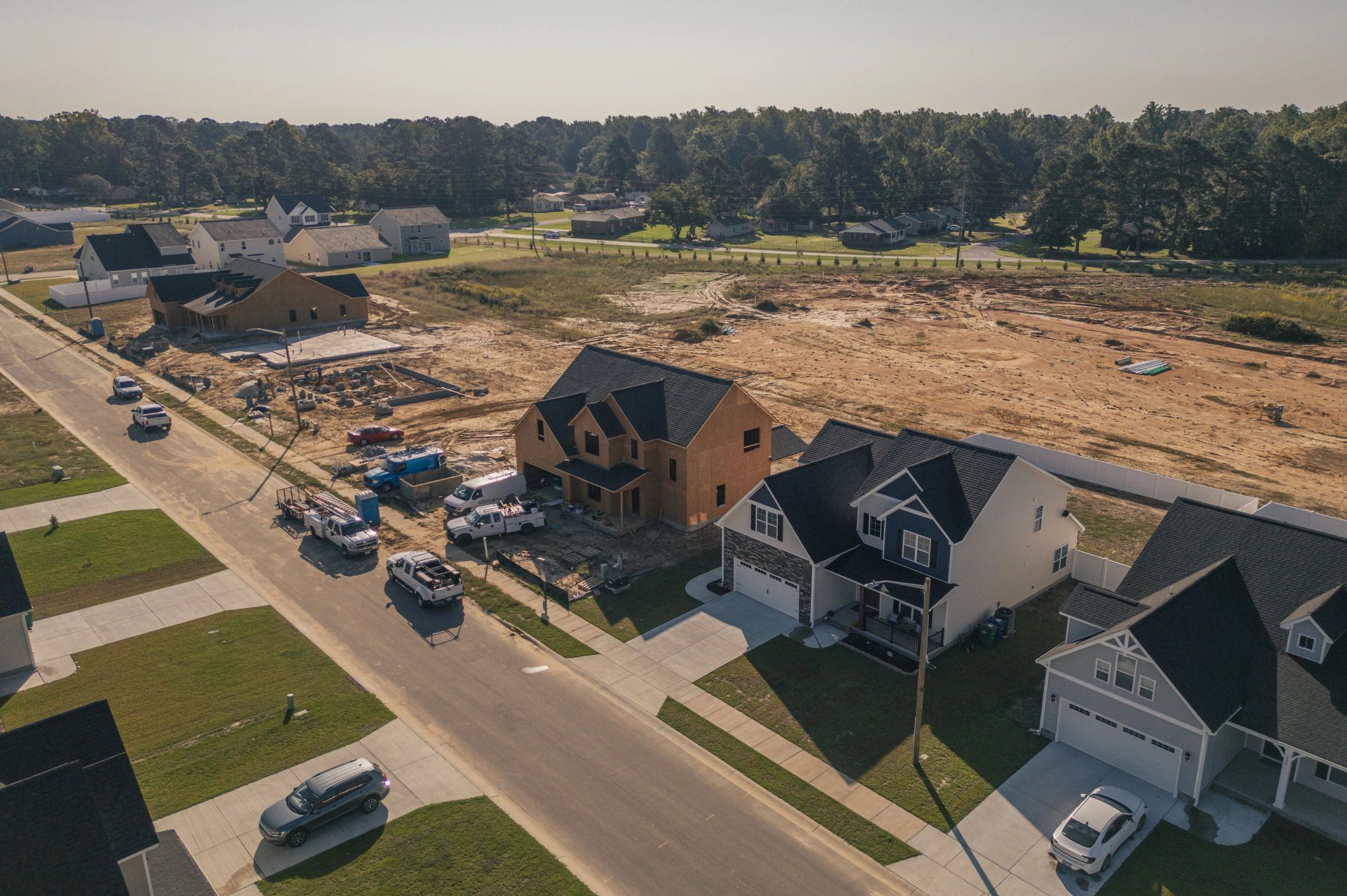 New construction neighborhood with rooftops, representing roof replacement service