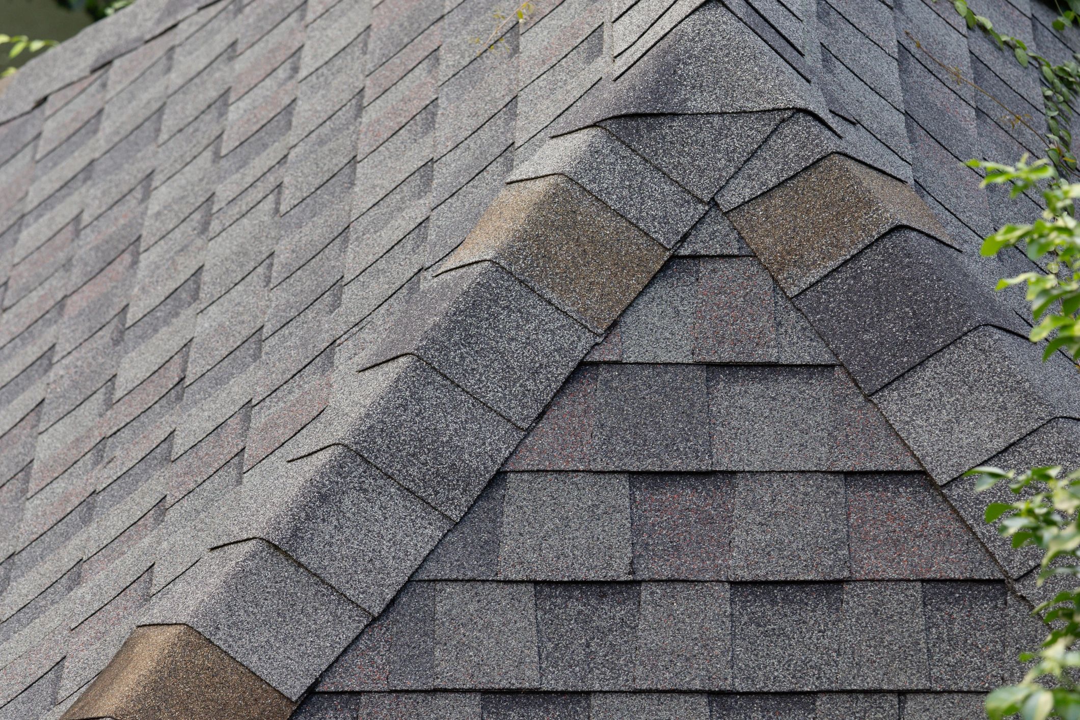 Roof shingle edge detail showing layered asphalt shingles