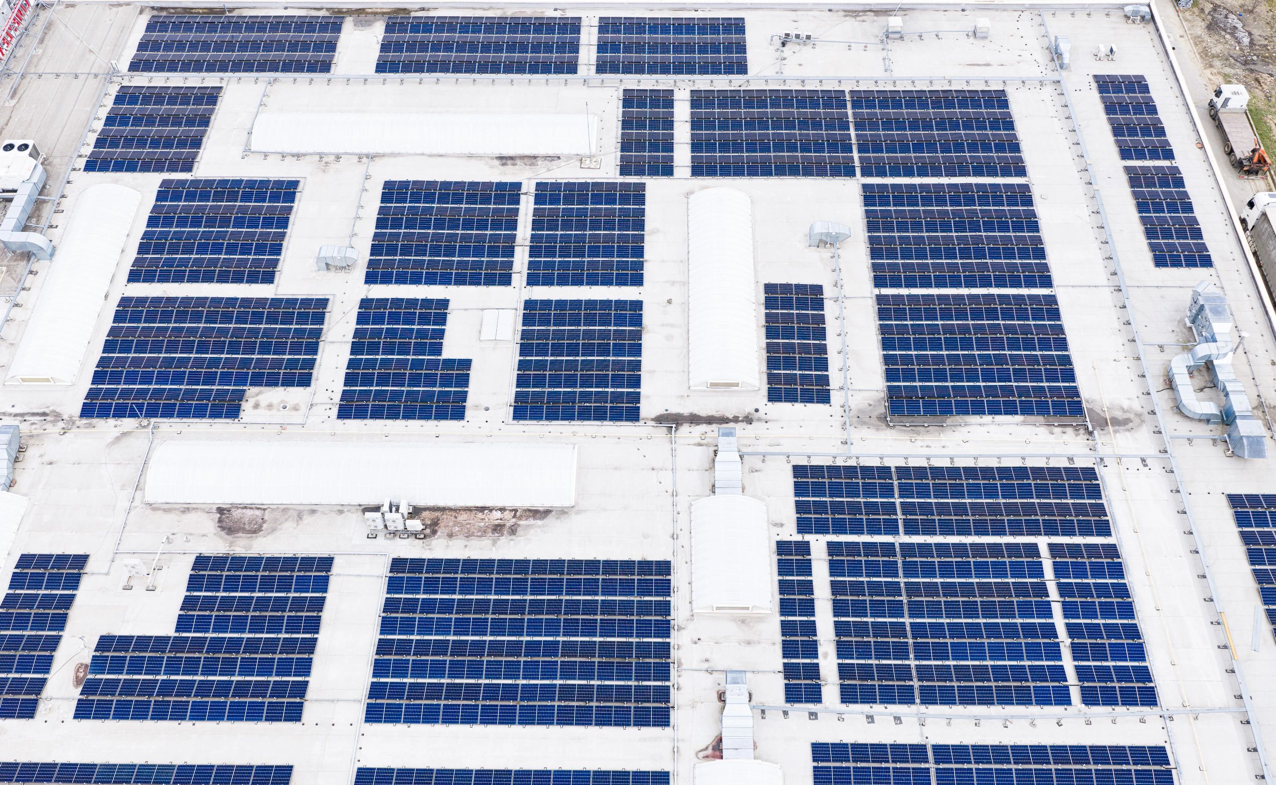 Industrial rooftop with solar panels on a flat roof