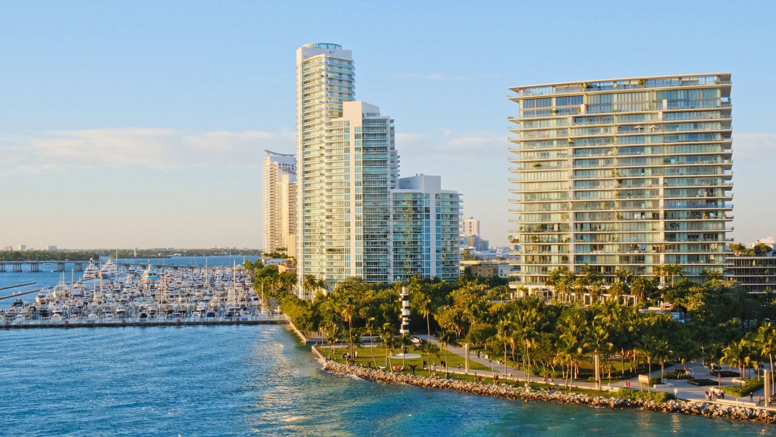 Aerial view of luxury waterfront residential buildings reflecting Miami Beach coastal roofing environments